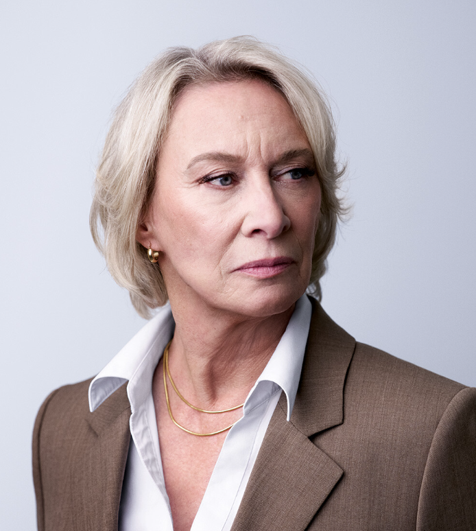 Headshot of Barbara Butcher, a white woman with short blonde hair.