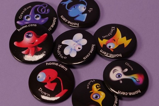 A photo of eight different badges CERN alumni can earn through different engagements. Each features a the name of the badge and a different colored and shaped creature.