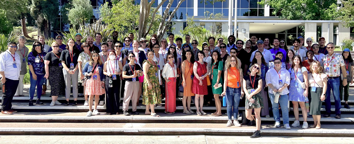 Caltech staff pose for a group photo outside.