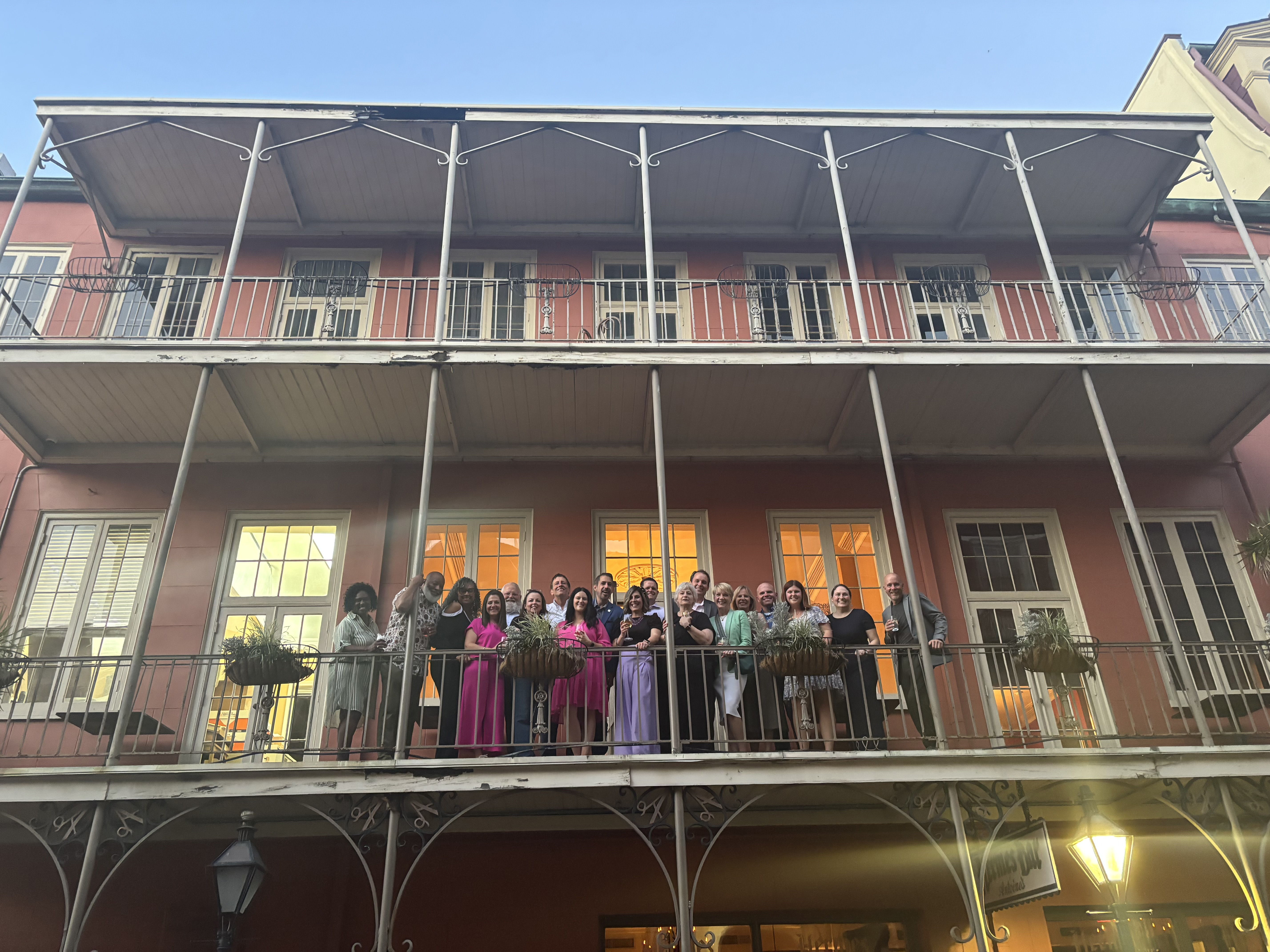 Photo of CCCA Planning Committee standing on a balcony in the French Quarter, New Orleans
