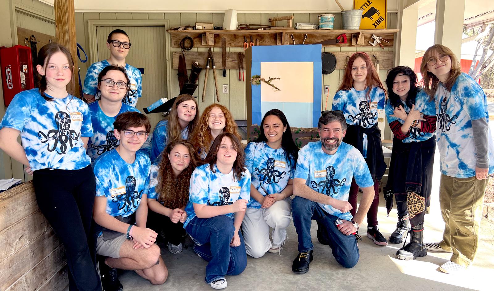 Students from Broad Creek Middle School in Newport, North Carolina pose for a photo in matching tie-dye shirts.