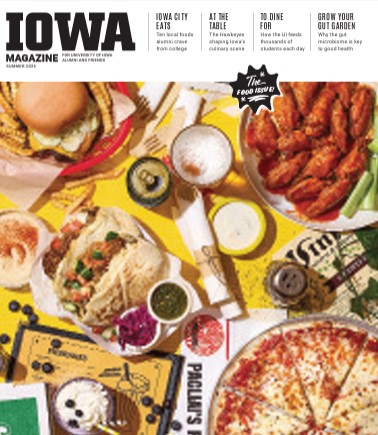 Iowa Magazine food edition cover displaying a table full of food. 