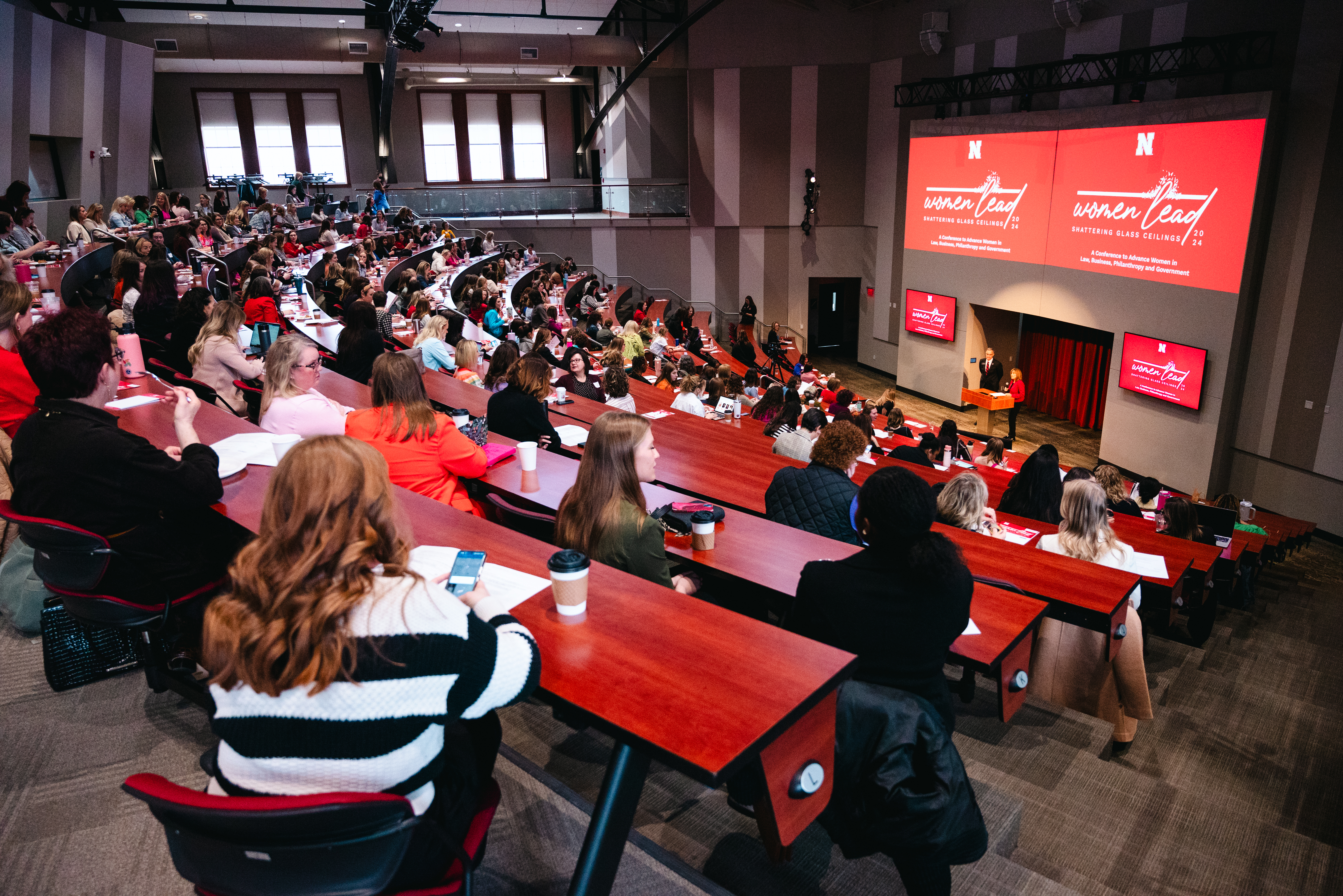 A group of women attend a business lecture