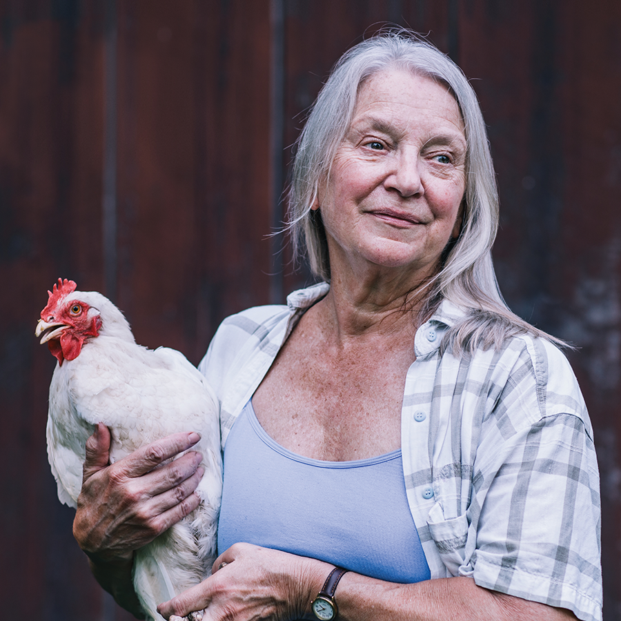 Milton Academy's Sibley Award-winning magazine cover image of woman holding a chicken