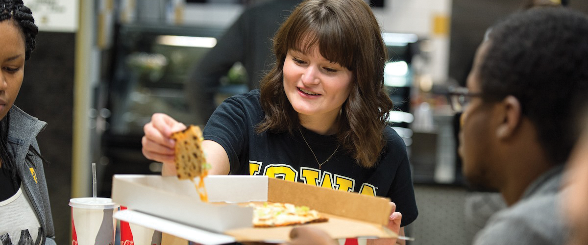 Eating pizza at the University of Iowa Center for Advancement