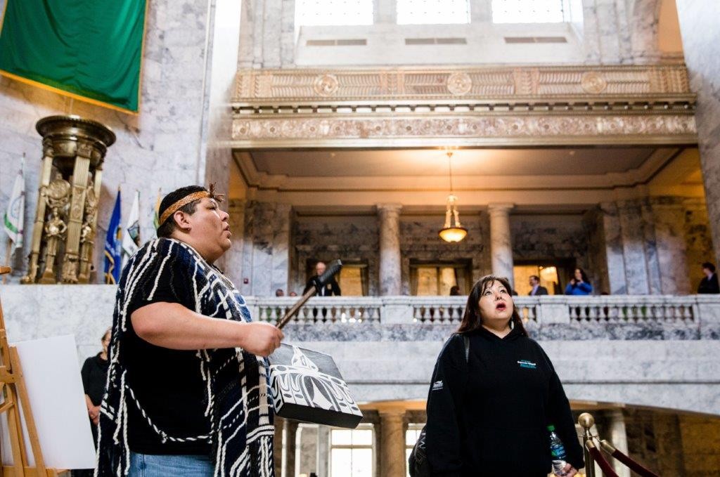 native american tribe members sing