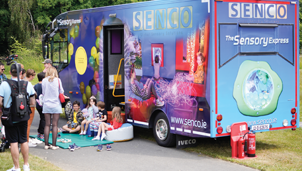 Kids sitting outside a sensory-play bus at University College, Dublin.