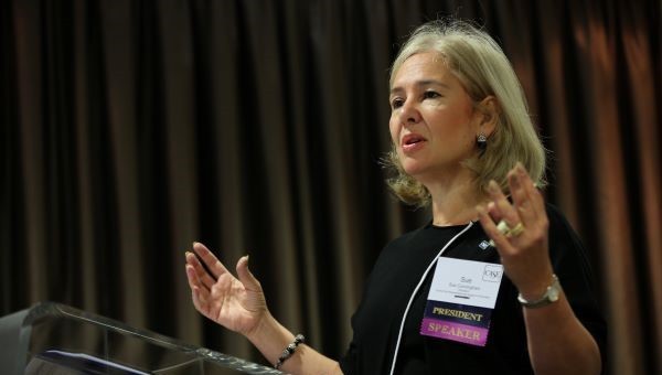 Sue Cunningham presents at a CASE conference.