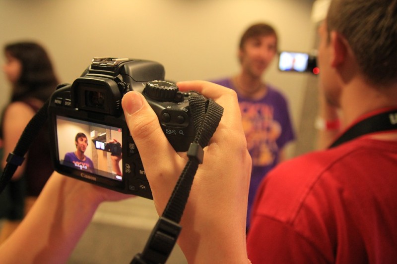 foreground camera shooting blury man in background