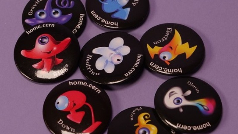 A photo of eight different badges CERN alumni can earn through different engagements. Each features a the name of the badge and a different colored and shaped creature.