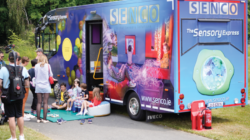 Kids sitting outside a sensory-play bus at University College, Dublin.