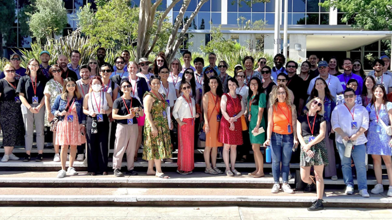 Caltech staff pose for a group photo outside.