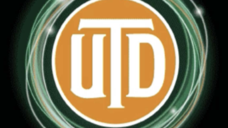 In an orange circle, white text reads, "UTD." Around the outside of the circle are green sparkling lines.