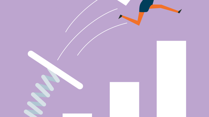 Woman in business suit bouncing over a bar graph