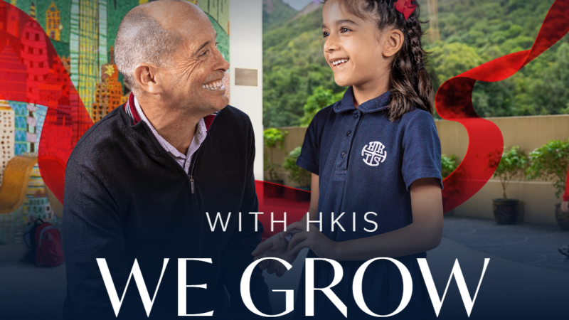 The words "With HKIS We Grow" accompany a photo of a HKIS student holding hands with an adult. Both have big smiles on their faces.