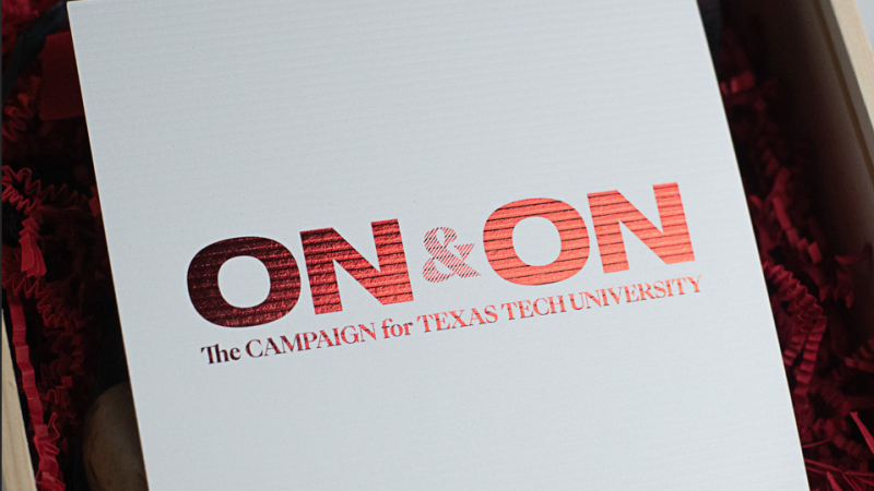 A piece of paper with "ON&ON: The Campaign for Texas Tech University" embossed in red.