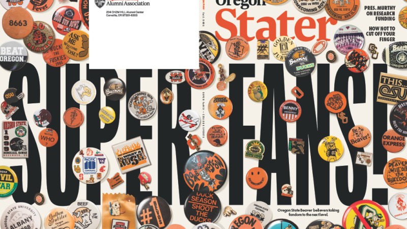 The Fall 2025 cover of the Oregon Stater features the headline "Super Fans!" in big black text. Partially covering the text are numerous photos of different fandom pins of various sizes.