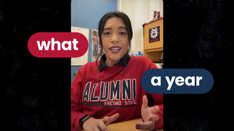 A woman wearing a red Fresno State alumni sweatshirt sits in an office talking to the camera. The caption reads, "What a year."