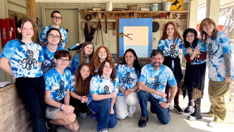 Students from Broad Creek Middle School in Newport, North Carolina pose for a photo in matching tie-dye shirts.
