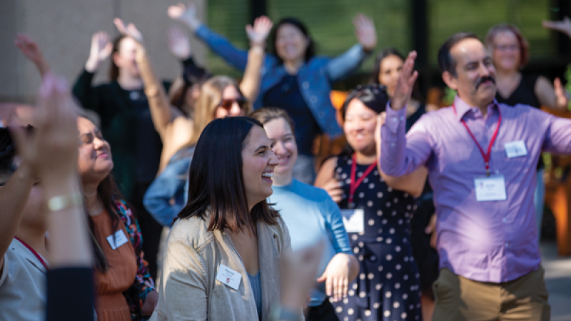 Stanford University staff members laughing at a staff retreat