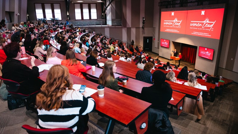A group of women attend a business lecture