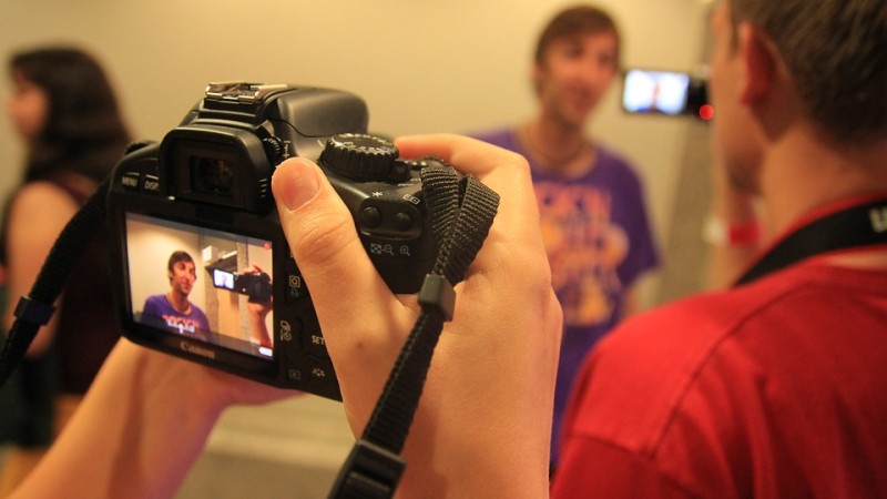 foreground camera shooting blury man in background